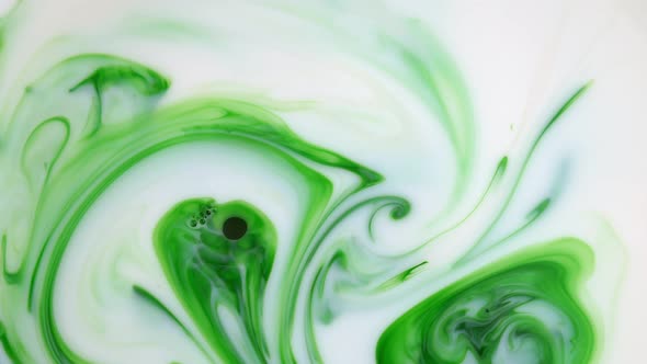  Footage. Ink in Water. Green Ink Reacting in Water Creating Abstract Background.