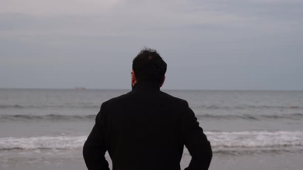 Alone Man Alone Man in Overcoat Watching the Sea with His Back Turned