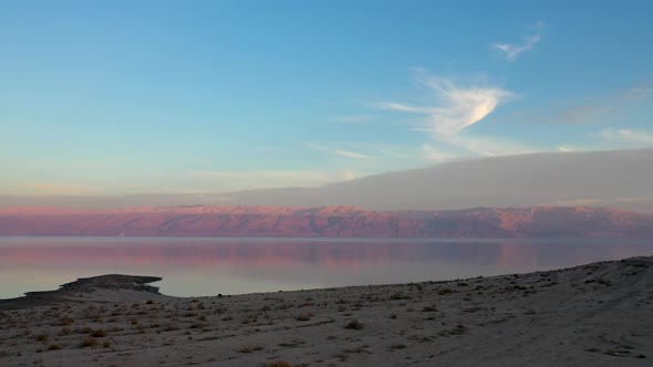 Israel, Deadsea, Red beautiful sunset over the deadsead sand mountains, drone shot