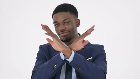 African Businessman Showing No Sign By Arm Gesture on White Background