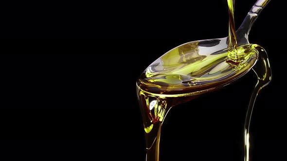 Olive Oil Pouring On A Spoon