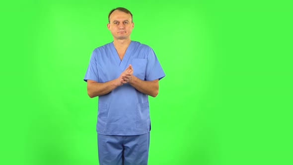 Medical Man Claps His Hands with Dissatisfaction. Green Screen