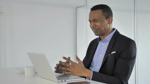 Frustrated Angry Casual AfroAmerican Businessman Working on Laptop