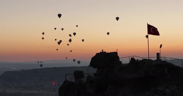 Aerial Cinematic Drone View of Colorful Hot Air Balloon Flying Over Cappadocia