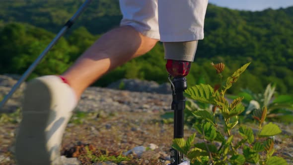 Bionic Prosthetic Leg for Sporty Man Person is Hiking and Walking in Nature Close Up