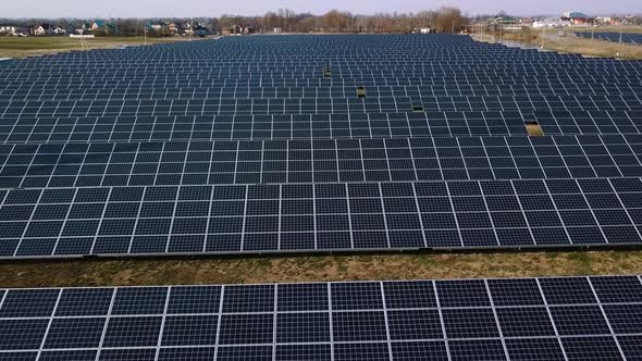 Aerial View Flying Over Solar Plant That Is Located Inside Valley