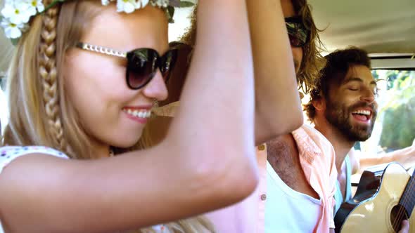 Hipster friends dancing in the van