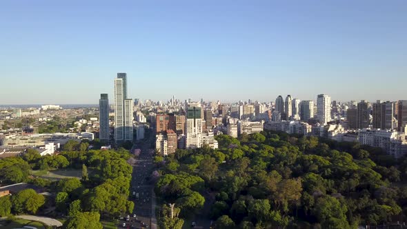 Aerial lowering of beautiful parks and Buenos Aires skyline at golden hour