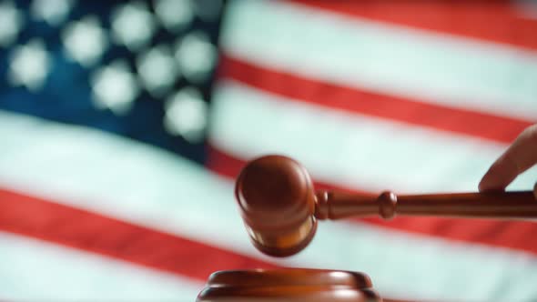 A Judge Gavel with a Flag of United States of America on Background
