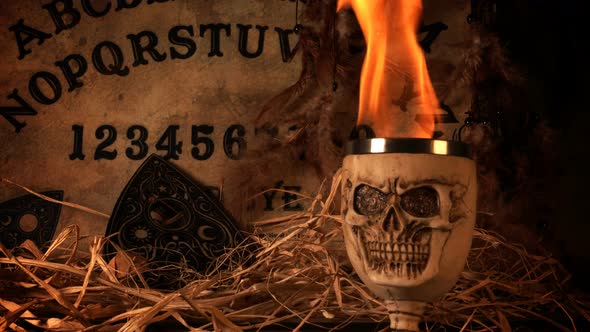 Ouija Spirit Board And Skull On Fire