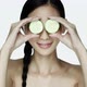 Young woman holding cucumber slices over eyes - VideoHive Item for Sale