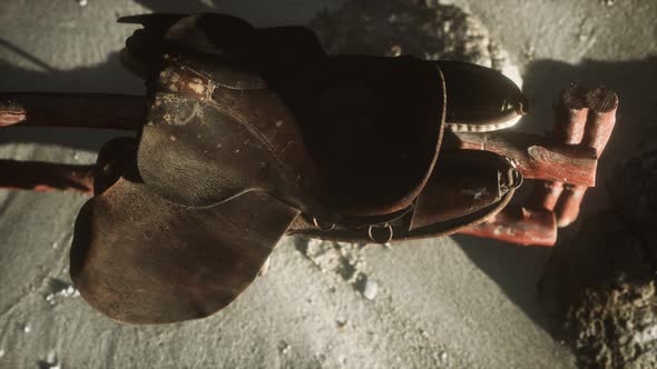 Rider Leather Saddle on Fence in Desert