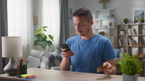 A Young Handsome Man Makes an Online Order and the Delivery Man Immediately Puts the Parcel on His