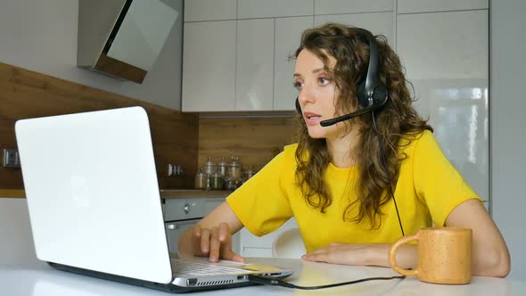 Young Woman is Having Online Meeting Using Her Laptop Businesswoman with Digital Tablet Sitting on