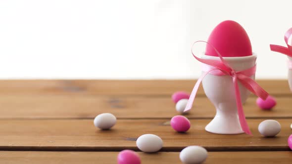 Easter Eggs in Holders and Candies on Table