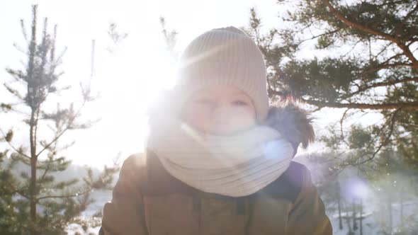 Shy Boy Posing in Snowy Forest