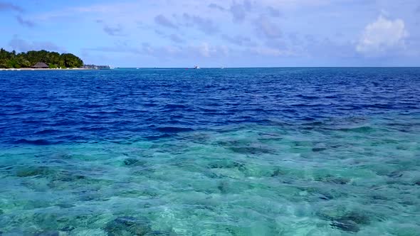 Summer seascape of coast beach by blue lagoon and sand background near sandbar