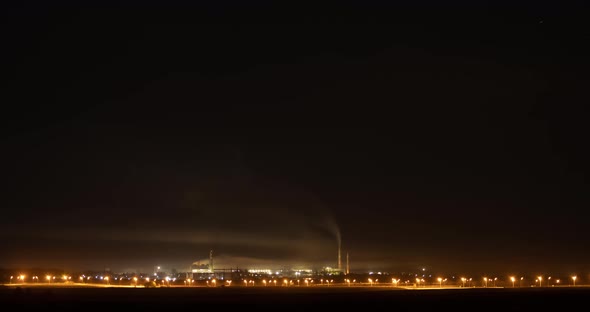 Night Stormy Sky Over An Industrial Plant. 