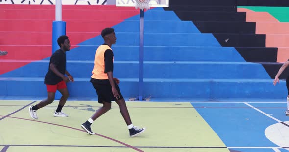 African friends playing basketball outdoor - Urban lifestyle concept