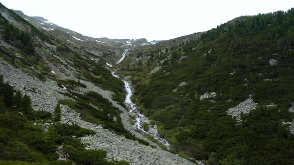 Aerial View of Mountain Landscape with Spring Waterfall Near Olpererhutte Zillertal Tirol Austria