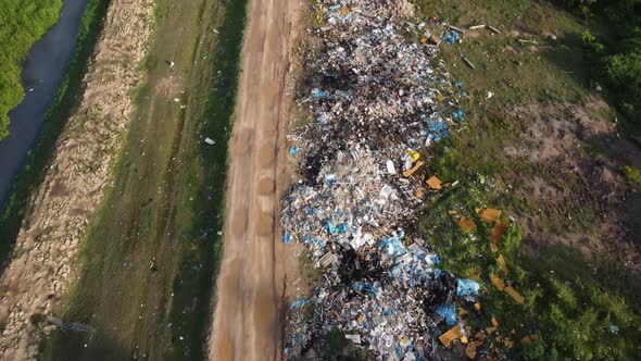 Industrial garbage thrown along rural path