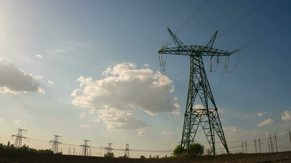 Time Lapse Electricity pylons Electrical towers with Clouds