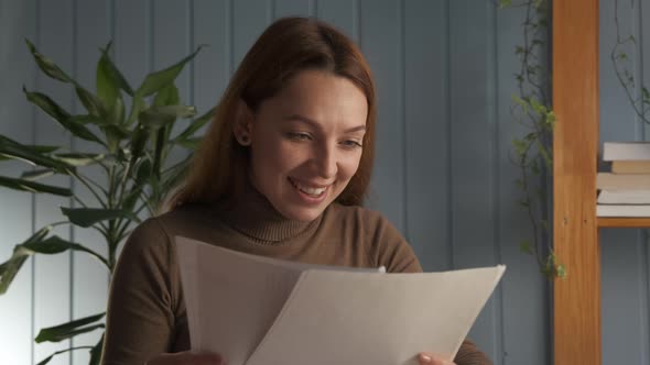 Woman Sitting at Desk Read Great Positive News in Letter Feels Happy
