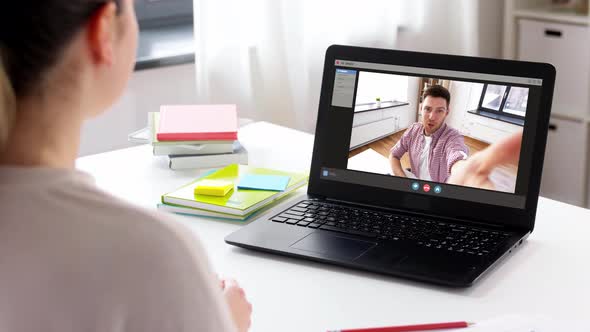 Woman with Laptop Having Video Call at Home