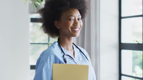 Portrait of smiling african american female doctor with stethoscope on the neck