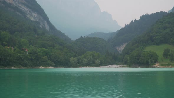 Scenic view at Lago di Tovel lake in Northern Italy with majestic alps in background