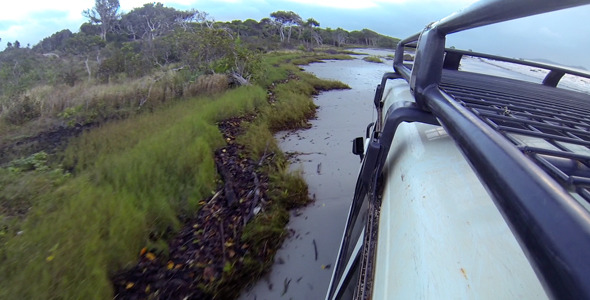 Driving Along a Beach alt