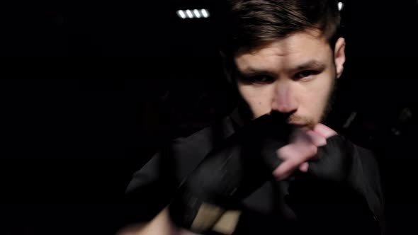 Portrait of a Bearded Male Boxer in a Sports Boxing Gym He Practices Punches