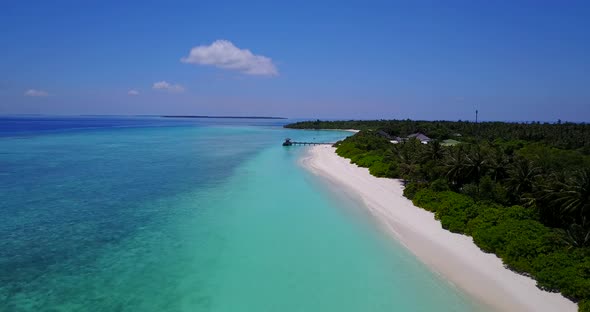 Beautiful aerial travel shot of a paradise sunny white sand beach and aqua turquoise water background