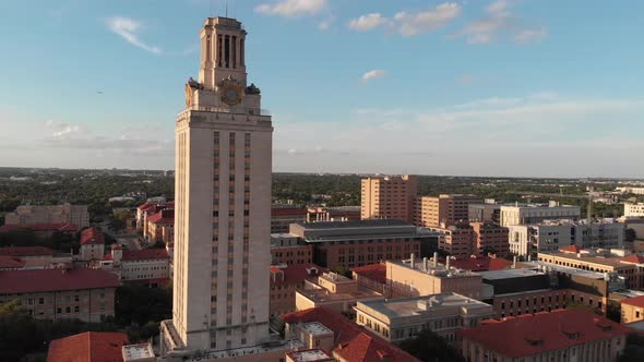 Slow rise of the tower on UT campus revealing the sprawling buildings of the University.
