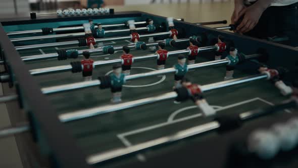 Closeup Foosball Game Table with Miniature Plastic Figures