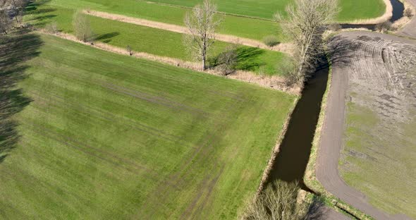 Aerial view of a small river crossing the countryside, Overijssel, Netherlands.