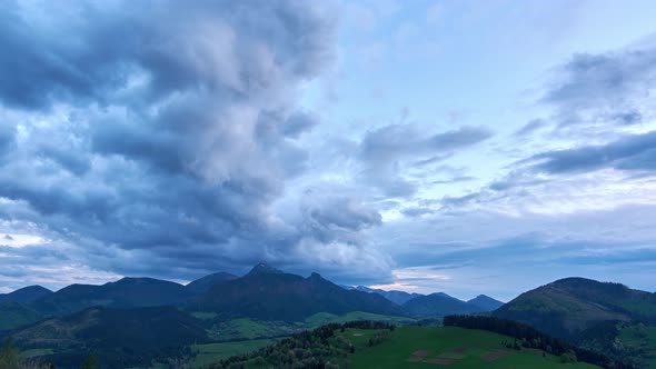 Spring Landscape with Cumulative Clouds A Huge Storm Cloud Forms Over the Mountains at Dusk