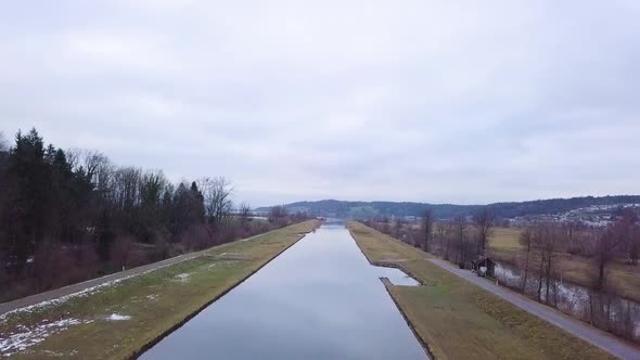 A very straight canal flows into one of the biggest lake in Switzerland.