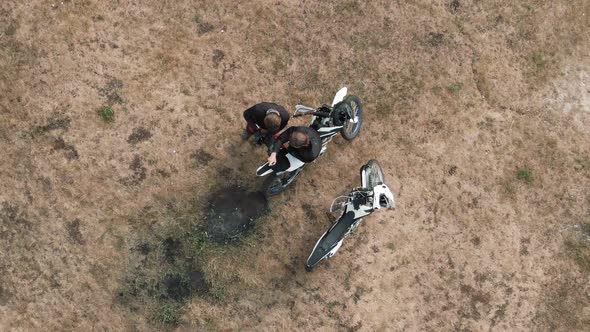 Aerial Shot of Motorcyclists with Mobile Phone Talking