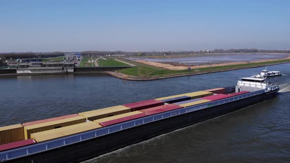 Ship Carrying Intermodal Containers In River Noord, Netherlands. drone ascend