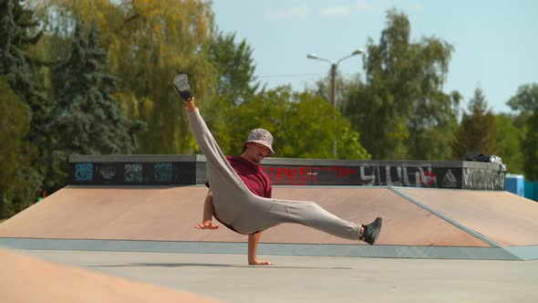 Man breakdancing in a skate park