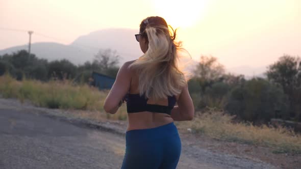 Young Woman Training for Marathon Run Outdoor