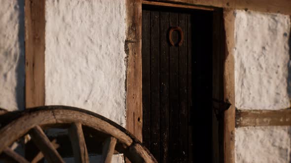 Old Wood Wheel and Black Door at White House alt