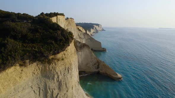 Drone Over Coastline Cliffs And Sea At Sunrise Of Cape Drastis