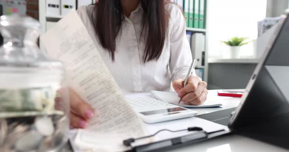 Accountant or Financial Advisor Checks and Compares Receipts Closeup