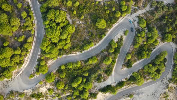 Aerial View of Winding Road in Beautiful Mountains at Sunset