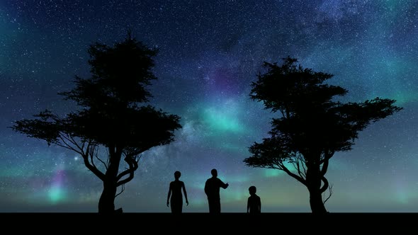 Silhouettes Family Against Stars