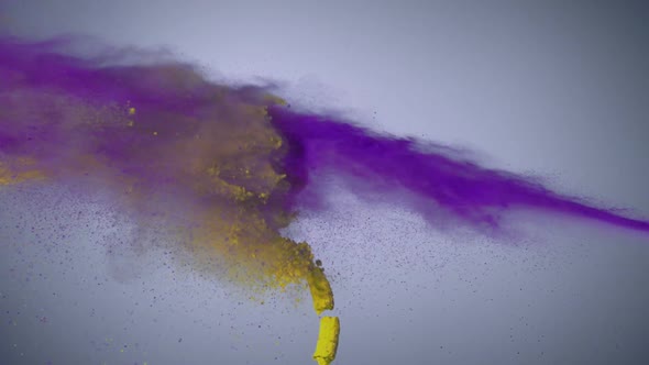 Purple and yellow powder colliding in the air, Slow Motion