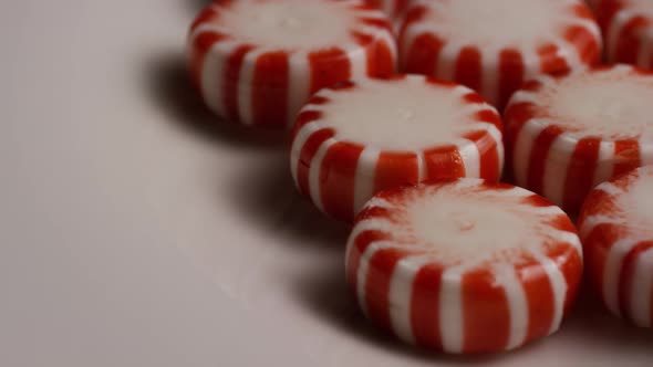 Rotating shot of peppermint candies - CANDY PEPPERMINT 036