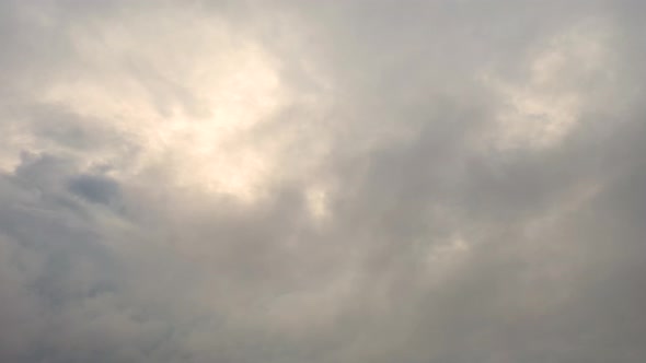 Aerial clouds flying sky in motion. Aerial view white clouds in blue sky during sunrise or sunset. 